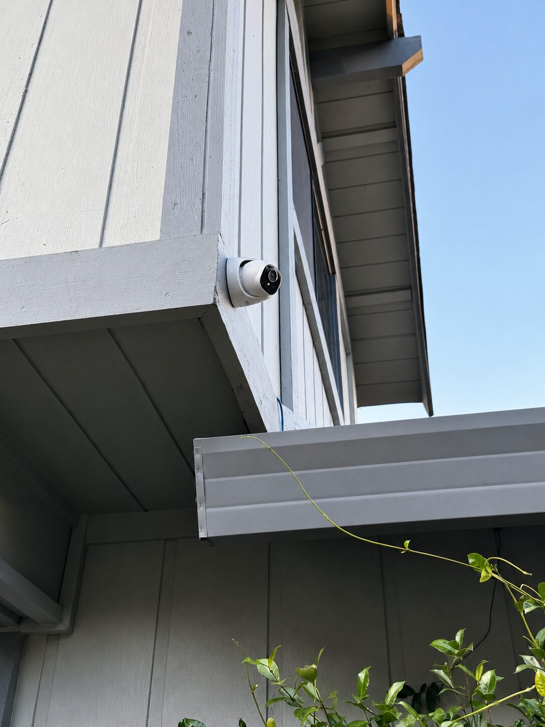 Reolink camera mounted under the eave for full driveway coverage