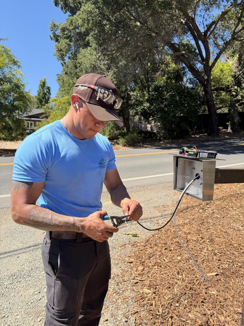 Diego from Sonoma Tech Solutions wiring a gate keypad
