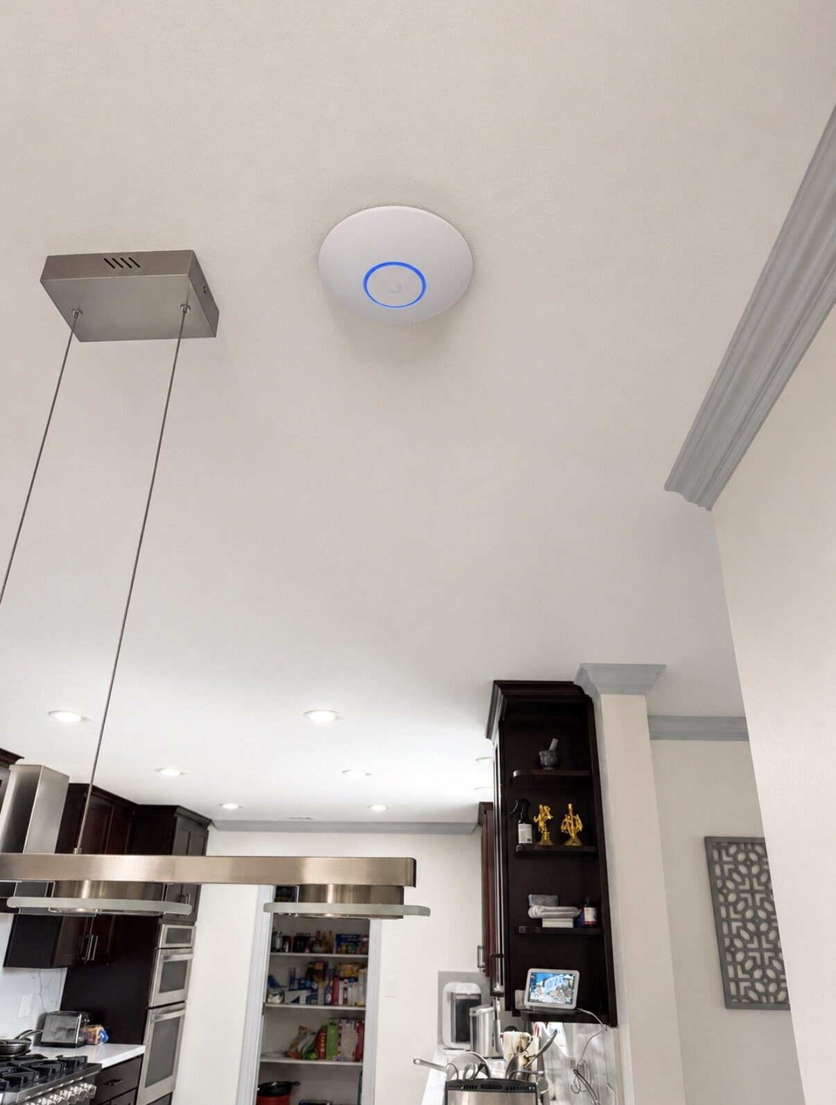 Discreet ceiling access point in a residential kitchen